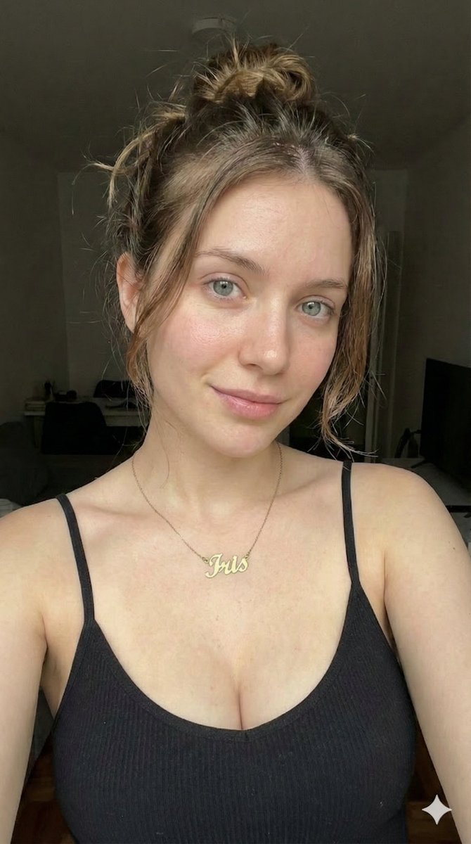 Low-Key Close-up Portrait with Nameplate Necklace — example output