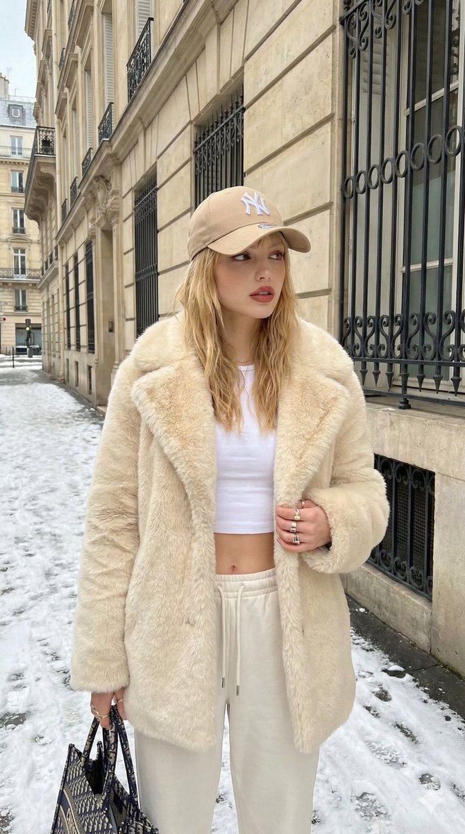 Street Style Fashion Photo in Snowy European City — example output
